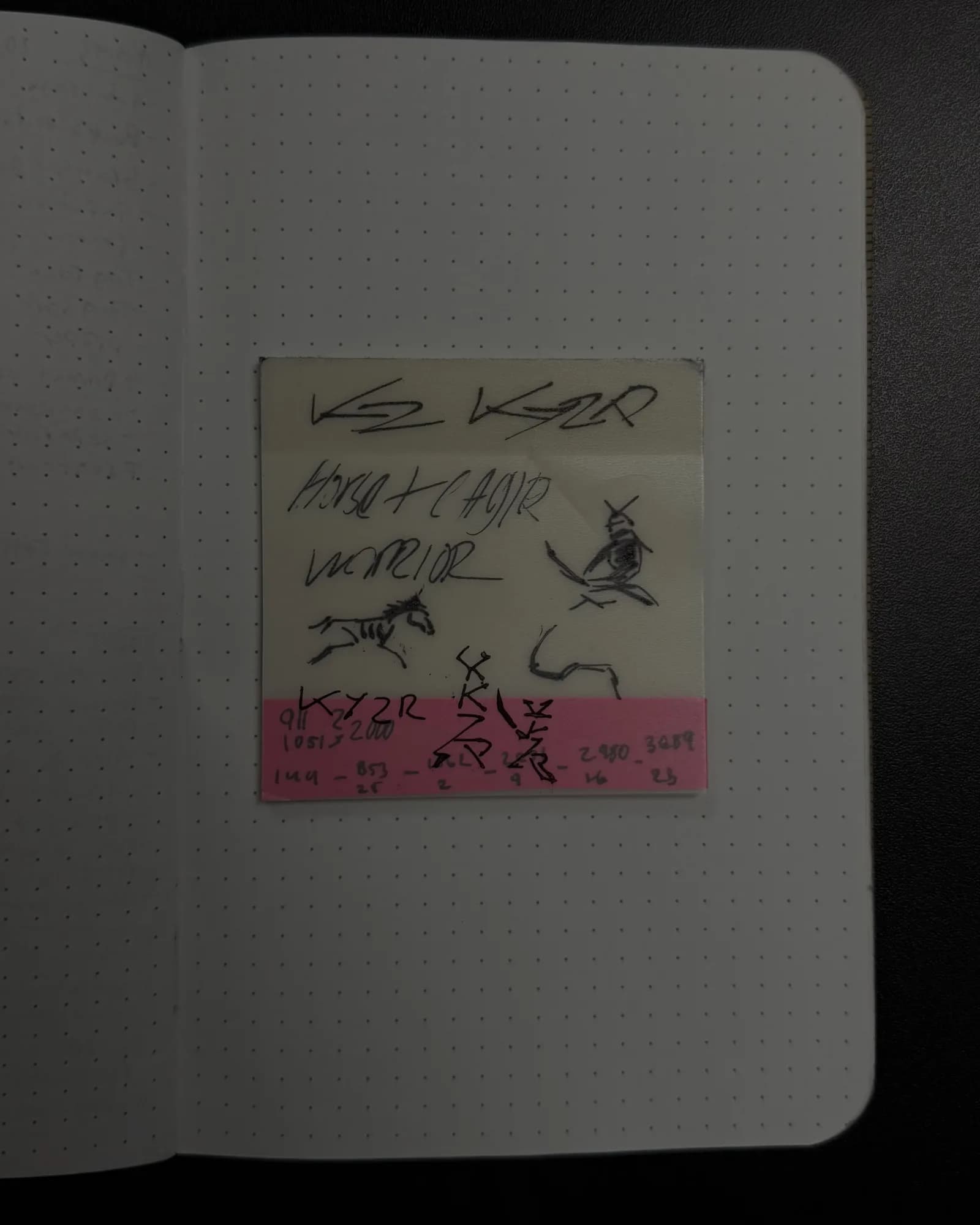 A notebook page of early Kyzr mark sketches: the K and Y lettermarks, a mounted archer, a running horse
